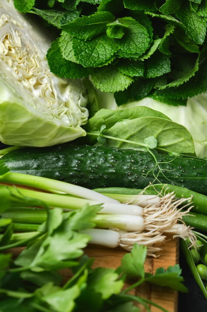 Close up Green vegetables, dark leafy food background.