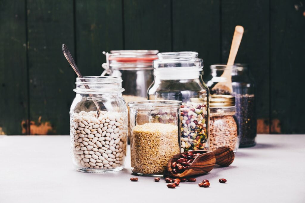 Glass jars with various legumes and grains