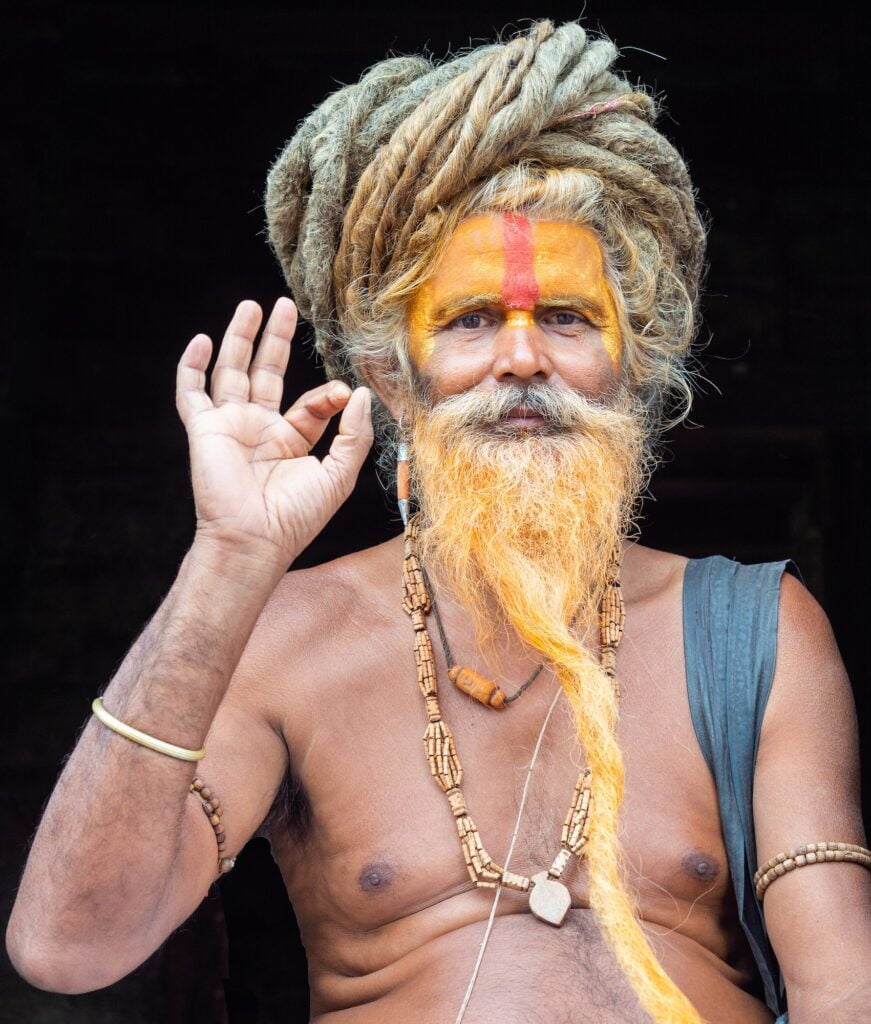 NEPAL, PASHUPATINATH TEMPLE - AUGUST 4, 2014: Indian shirtless man showing ok gesture
