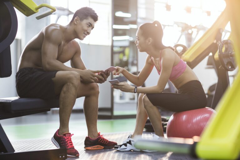 Young couple resting at gym